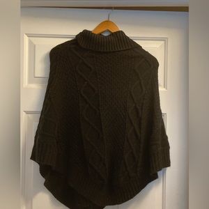 Woman’s knit turtleneck poncho